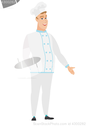 Image of Caucasian chef cook with hand in his pocket.