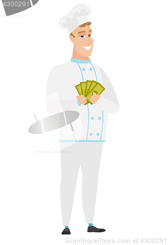 Image of Happy caucasian chef cook holding money.
