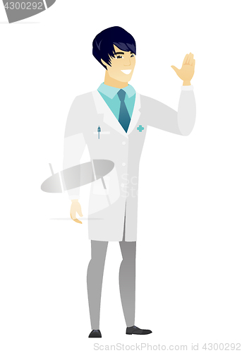 Image of Young asian doctor waving his hand.