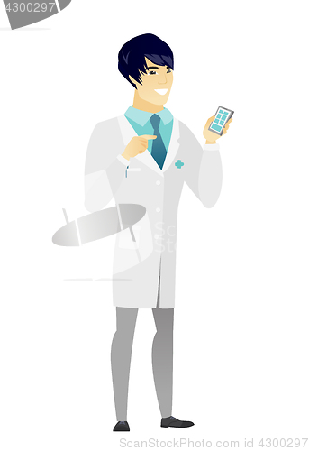 Image of Asian doctor holding a mobile phone.