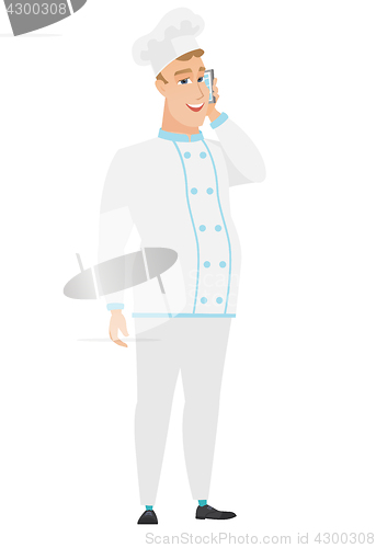 Image of Chef cook talking on a mobile phone.