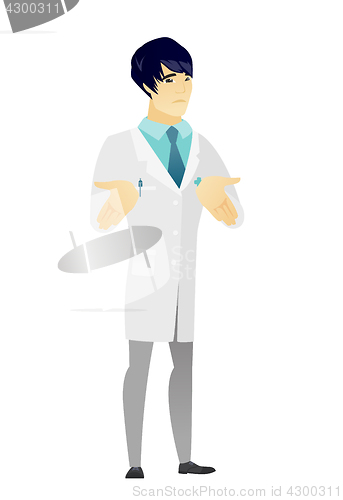 Image of Asian confused doctor shrugging shoulders