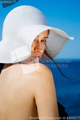 Image of Charming model in straw hat