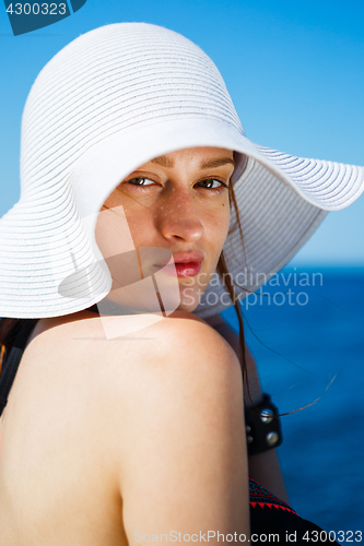 Image of Charming model in straw hat