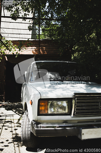 Image of Sensual model posing on car