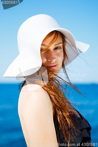 Image of Charming model in straw hat