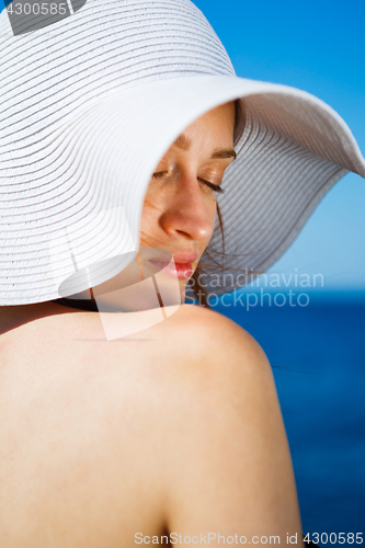 Image of Charming model in straw hat