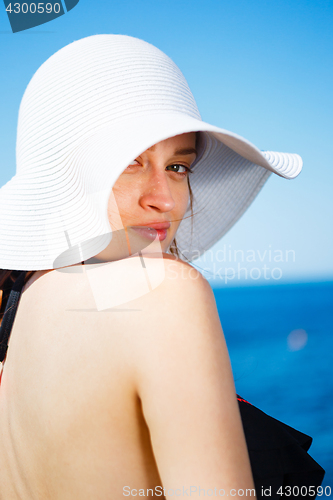 Image of Charming model in straw hat