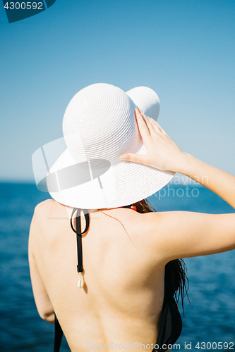 Image of Anonymous model in swimwear and hat