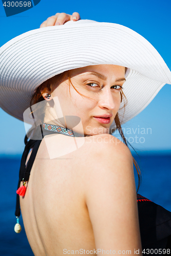Image of Charming model in straw hat