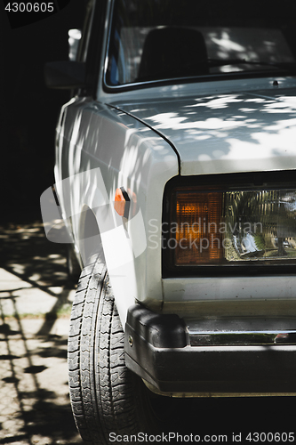 Image of Sensual model posing on car