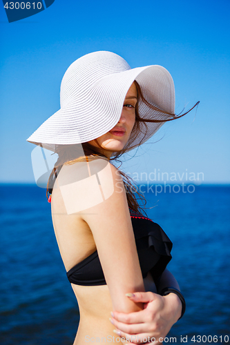 Image of Charming model in straw hat