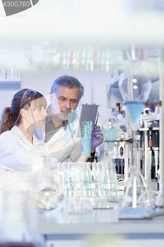 Image of Health care researchers working in scientific laboratory.