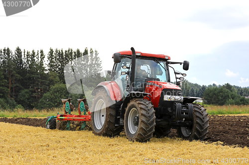 Image of Case IH Tractor and Plow Working on Field