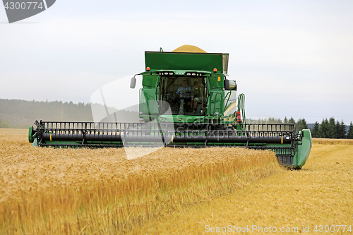 Image of John Deere Combine T660 Harvests Barley 