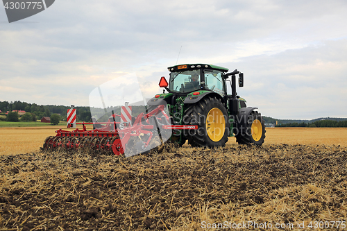 Image of John Deere 6155R Tractor and Horsch Cultivator on Field