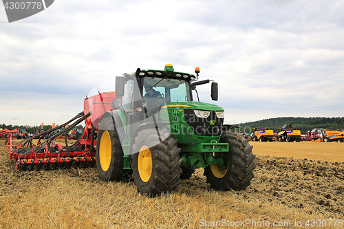 Image of John Deere 6155R Tractor and Vaderstad Seed Drill on Field