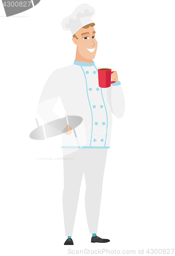 Image of Young caucasian chef cook holding cup of coffee.
