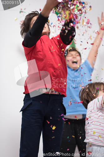 Image of kids  blowing confetti