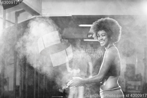 Image of black woman preparing for climbing workout