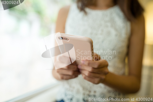 Image of Woman using smartphone