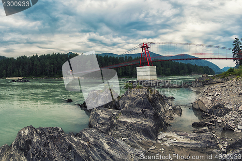 Image of suspension bridge on mountain river