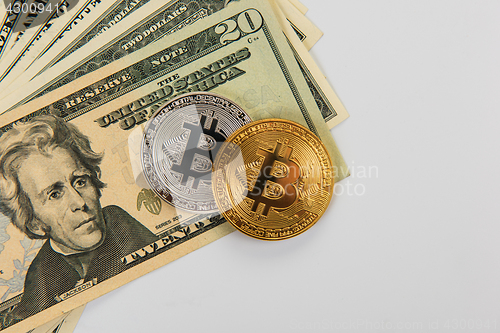 Image of Bitcoin coin with dollars