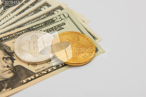 Image of Bitcoin coin with dollars