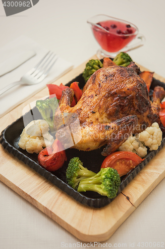 Image of Roasted chicken with vegetables.
