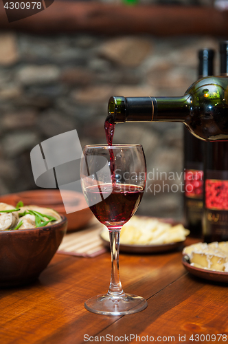 Image of Pouring red wine