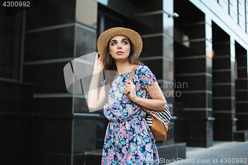 Image of The fashion woman portrait of young pretty trendy girl posing at the city in Europe