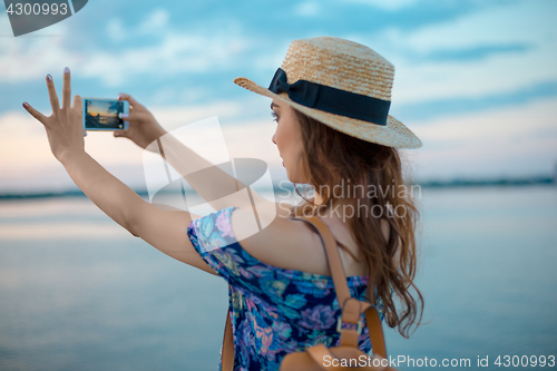 Image of Young woman and river at city