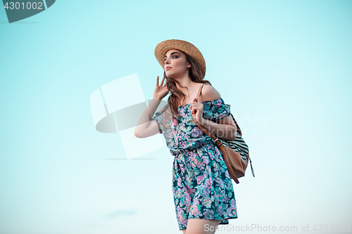 Image of Young woman and blue sky