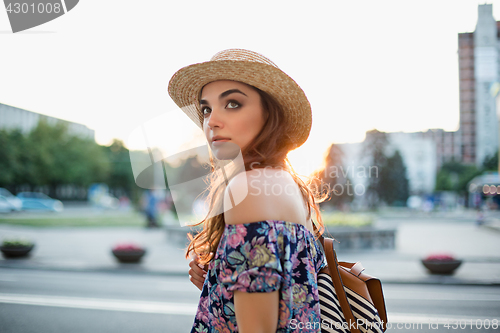 Image of The fashion woman portrait of young pretty trendy girl posing at the city in Europe