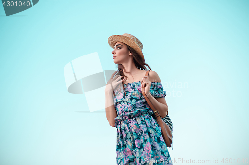 Image of Young woman and blue sky