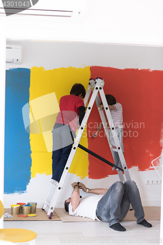 Image of boys painting wall