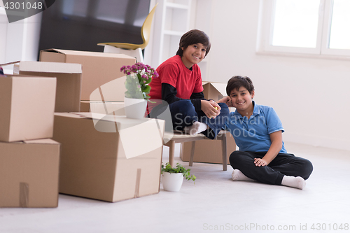 Image of boys with cardboard boxes around them