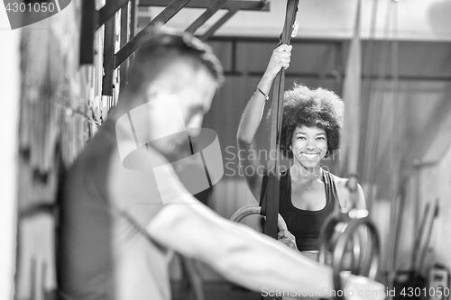 Image of Portrait of multiethnic couple  after workout at gym