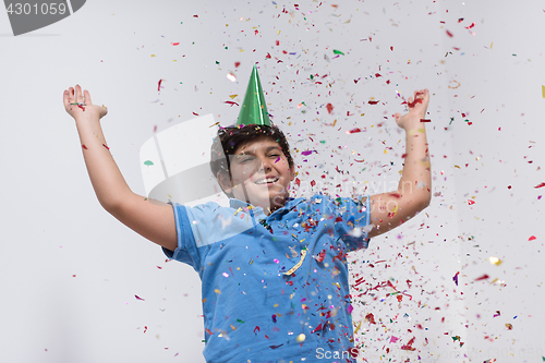 Image of kid blowing confetti