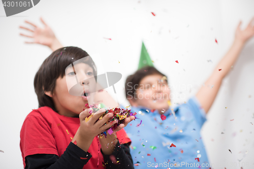 Image of kids  blowing confetti