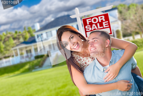 Image of Playful Excited Military Couple In Front of Home with For Sale R