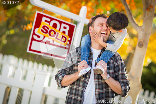 Image of Young Mixed Race Chinese and Caucasian Father and Son In Front o