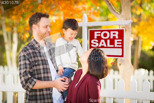 Image of Young Mixed Race Chinese and Caucasian Family In Front of For Sa