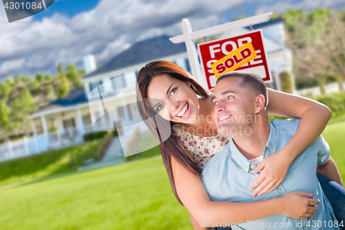 Image of Playful Excited Military Couple In Front of Home with Sold Real 