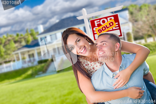 Image of Playful Excited Military Couple In Front of Home with Sold Real 