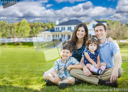 Image of Happy Young Family With Children Outdoors In Front of Beautiful 