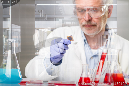 Image of Senior life science research researching in modern scientific laboratory.
