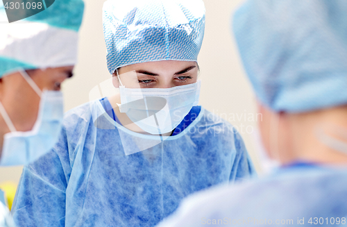 Image of group of surgeons in operating room at hospital