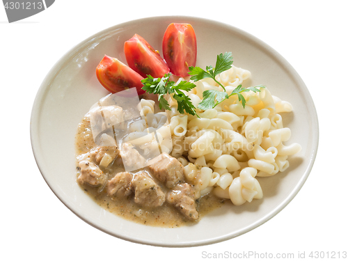 Image of Pork goulash with macaroni and sliced tomato, isolated on white background