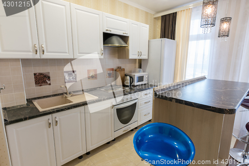 Image of Interior of a one-room apartment, view of a kitchen set